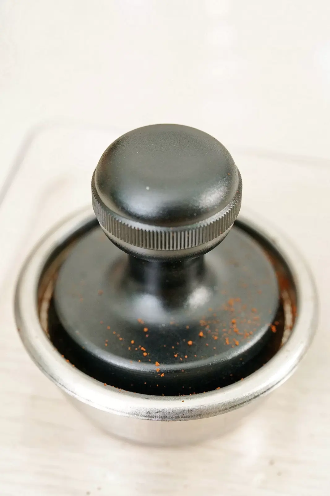 Femobook A2 Coffee Grinder - Ground Coffee being tamped