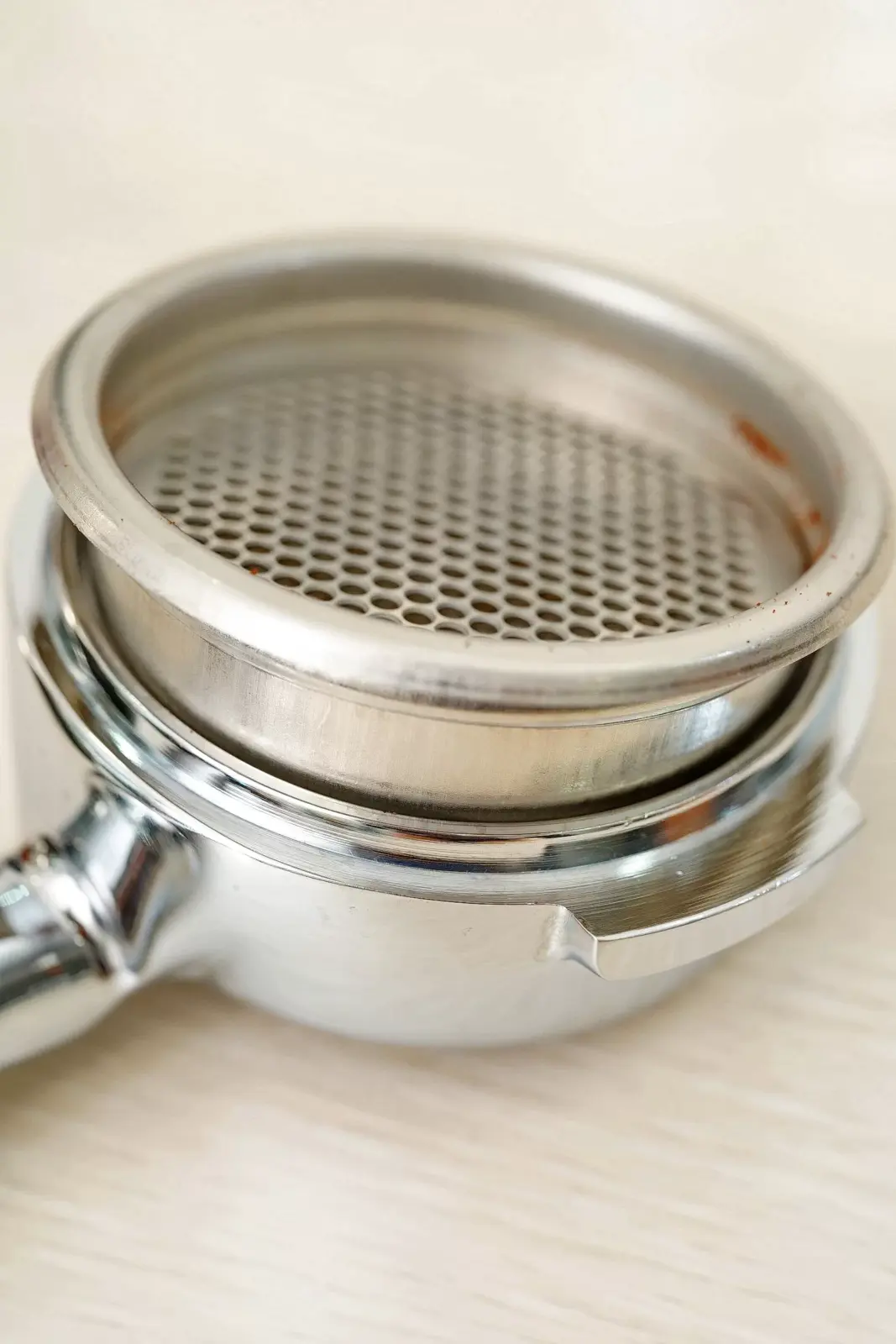 Femobook A2 Coffee Grinder - Tamped Ground Coffee loaded on the Portafilter