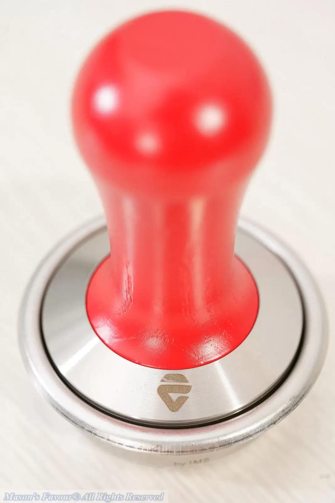 Lelit PLA481R Tamper - PLA481R Tamper Tamping the Ground Coffee in the IMS Filter Basket