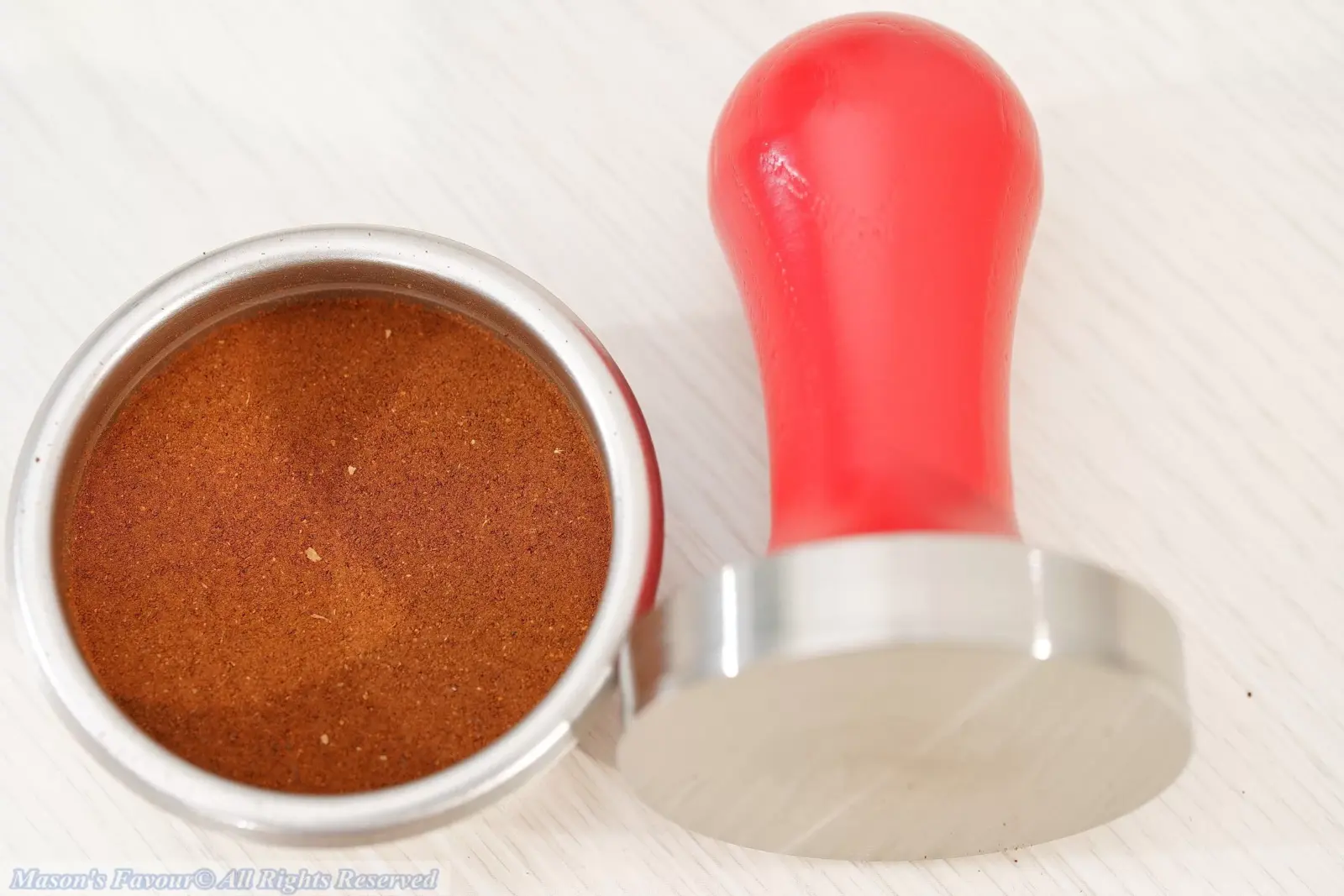 Lelit PLA481R Tamper - PLA481R Tamper Finishing the Tamping of the Ground Coffee in the IMS Filter Basket