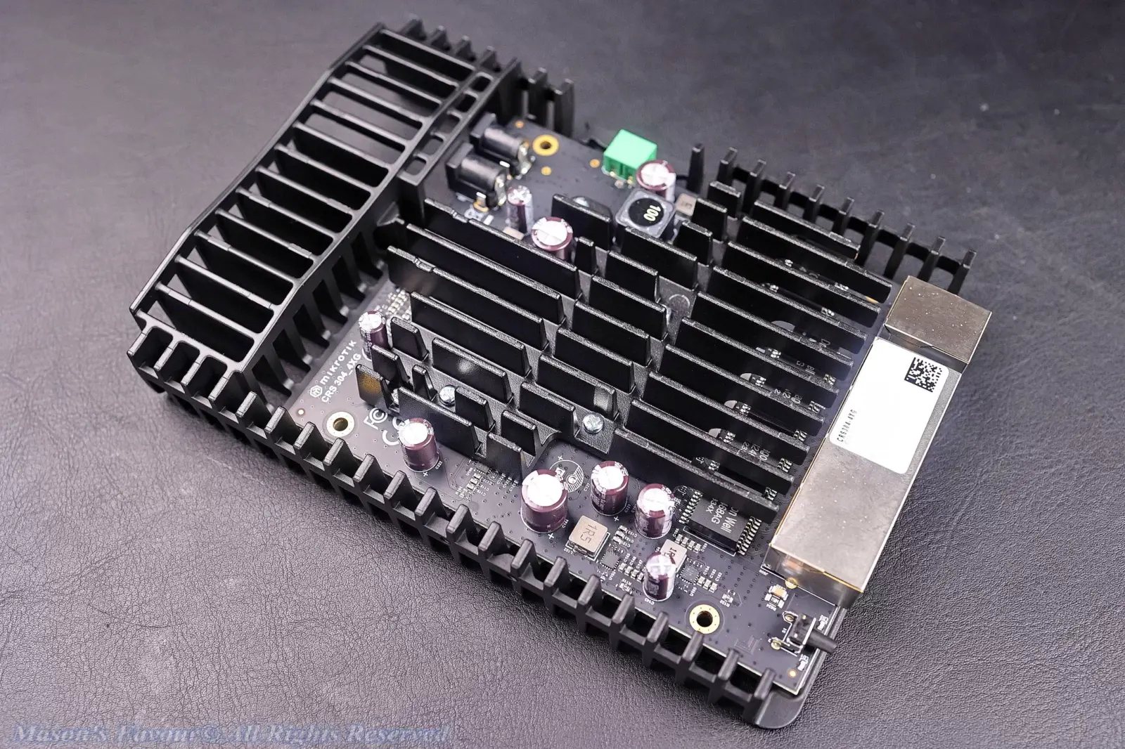 MikroTik CRS304-4XG-IN - Teardown, with the Top White Plastic Cover removed, Perspective 1