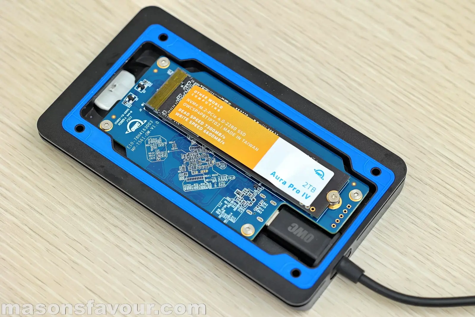 OWC Envoy Ultra Thunderbolt 5 SSD - Bottom Base Heatsink, PCB, and Aura Pro IV SSD 2TB, Perspective 1