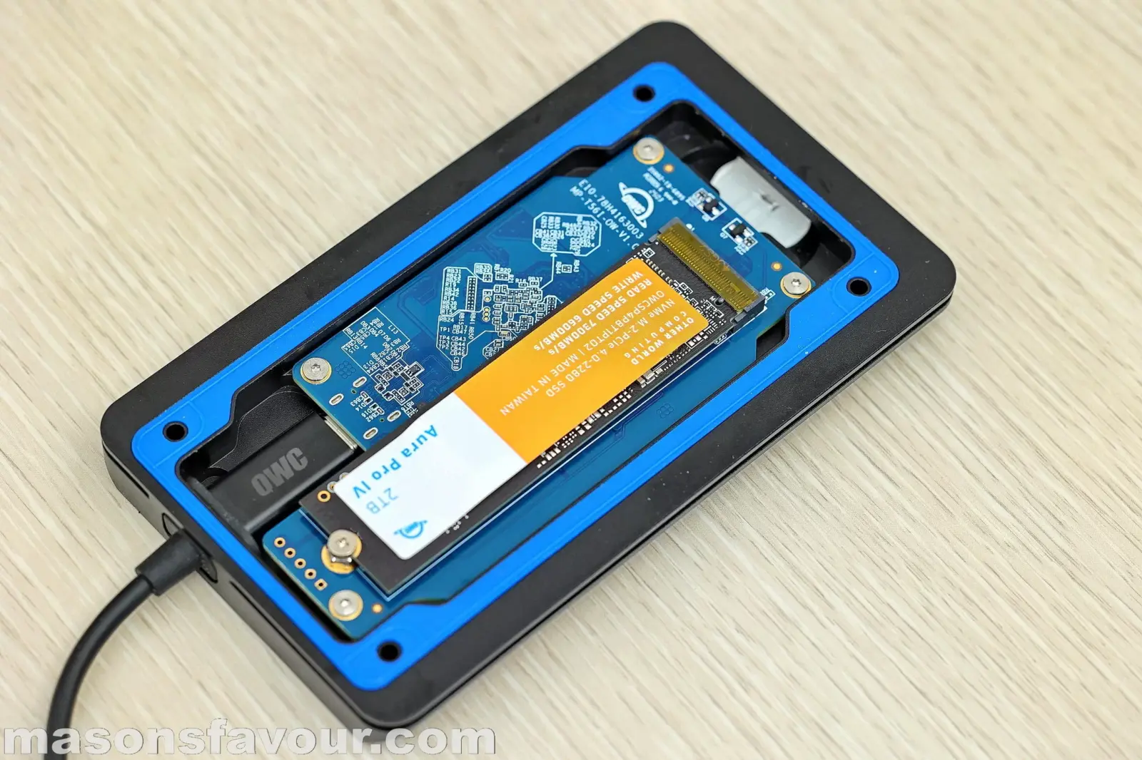 OWC Envoy Ultra Thunderbolt 5 SSD - Bottom Base Heatsink, PCB, and Aura Pro IV SSD 2TB, Perspective 2