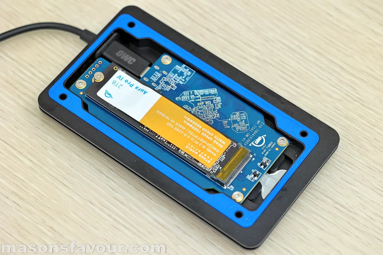 OWC Envoy Ultra Thunderbolt 5 SSD - Bottom Base Heatsink, PCB, and Aura Pro IV SSD 2TB, Perspective 3