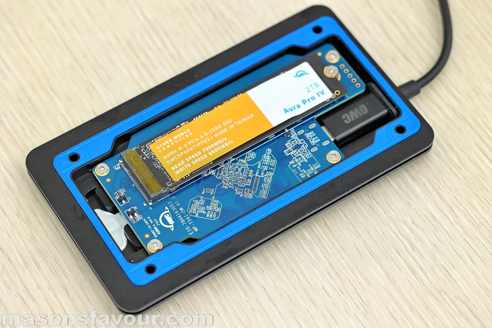 OWC Envoy Ultra Thunderbolt 5 SSD - Bottom Base Heatsink, PCB, and Aura Pro IV SSD 2TB, Perspective 4